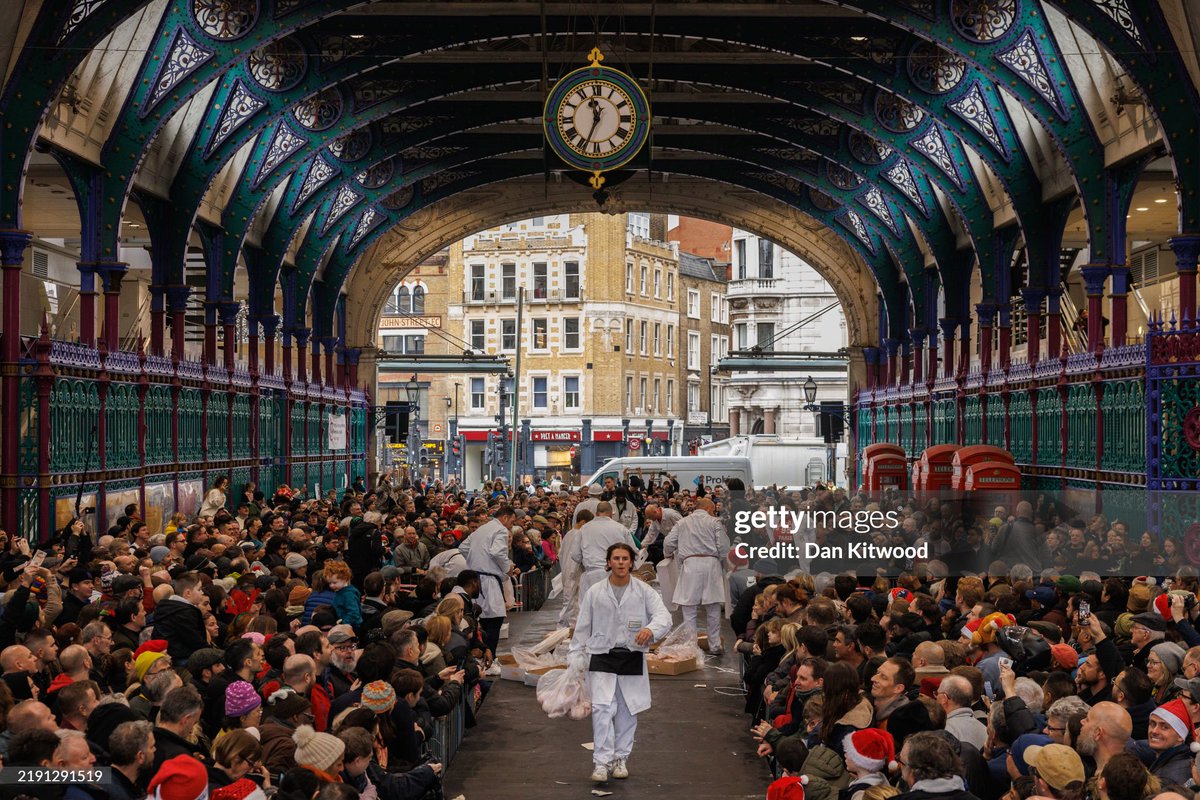 Butchers take bids and sell their surplus meat to last-minute holiday shoppers at the annual Christmas Eve auction at Smithfield Market in London. It was announced that Smithfield and the Billingsgate fish market will be closing at the site by 2028 after 800 years in operation.