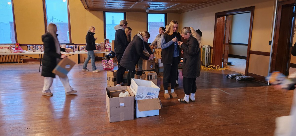ATLgirlsbball's tweet photo. We also helped the Atlantic Police Department with Family Dreams Christmas this past Saturday. Always a good day helping set up toys and seeing kids pick out Christmas gifts! We love our #TrojanCommUNITY! https://t.co/XurpqXozo0