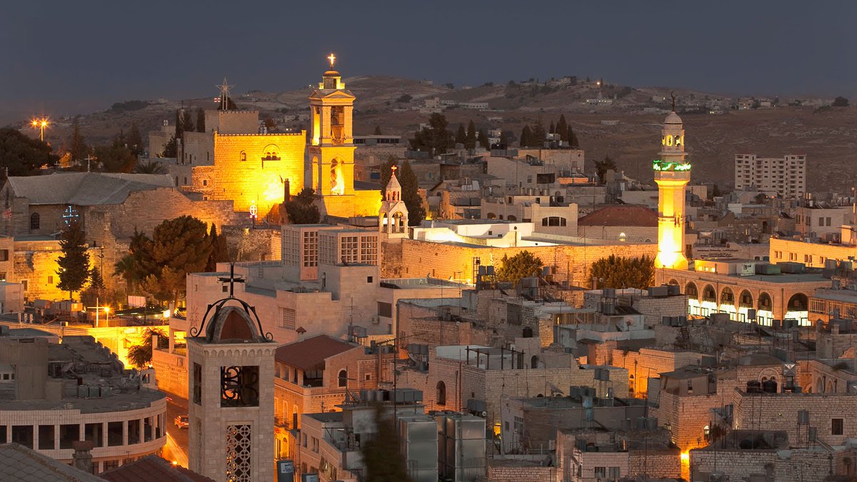 O little town of Bethlehem
How still we see thee lie
Beyond thy bleak &amp; dreamless sleep
The deathly comets fly
And in your torn streets haunted
By visions of the dead,
The walls don't shield &amp; can't rebuild
A house of broken bread

Greenbelt’s poignant version of the famous carol