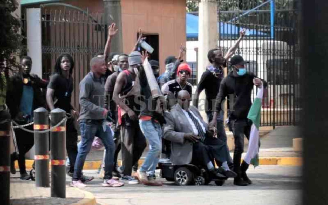 _Abdul_M_'s tweet photo. "They were baying for our blood". Here's a photo of protesters escorting a UDA MP out of parliament. You shifted the narrative to make it seem youths were there to cause havoc and harm.

We won't forget 

#EndAbductionsKE https://t.co/ETNjJOcM6f