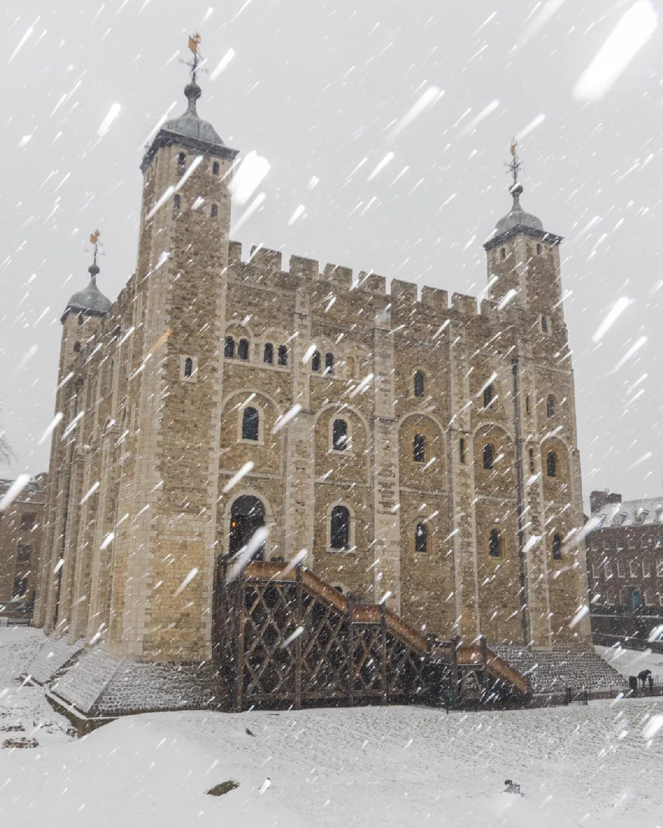 The Tower of London with snow falling 