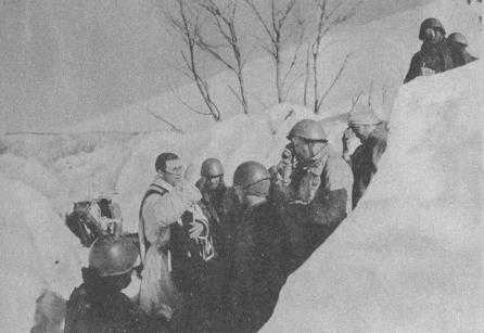 In the Albanian mountains, a Christmas truce between Greek &amp; Italian forces- soldiers crossing no-man's land between enemy trenches with gifts.
