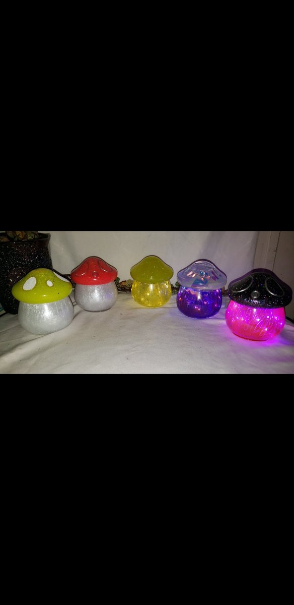 Arielhood82's tweet photo. I'm showing y'all my art today! A few of my mushroom jars and Moody Mushroom Jars (cottages). Some glow,some shine,some have lights... Plain mushroom jars or the cottage jars? #art #handmadeart #decor #hippiedecor #whimsicaldecor #mushroomhouse #mushroomjar https://t.co/3W7NcmE5if