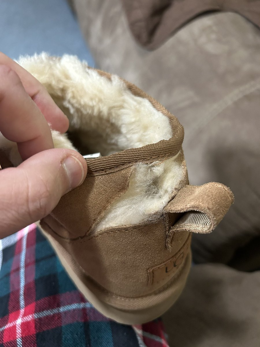 Highland23's tweet photo. Thanks @UGG for selling us used boots. Nothing like opening a gift on Xmas to find them gross and ripped. Hope these are returnable! #wtf https://t.co/7cJqpRgSNM