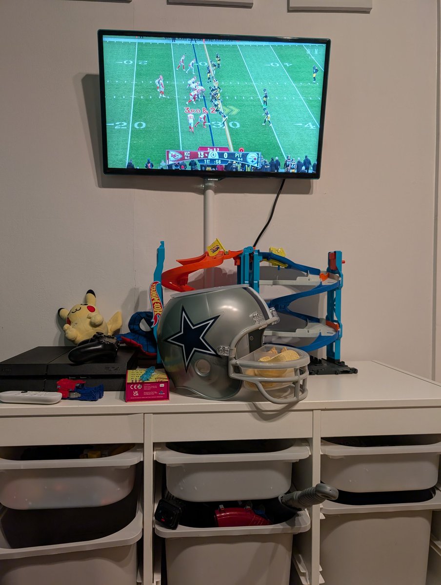 rosswelsh's tweet photo. Me and my son watching from York, England. Trying out my new Cowboys snack helmet @ScottHanson @drewbrees #NFLonNetflix https://t.co/q6tjccn2ZQ