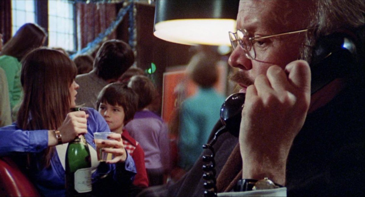 JakeTropila's tweet image. Margot Kidder offering a small child alcohol in a split diopter shot in Black Christmas (1974)