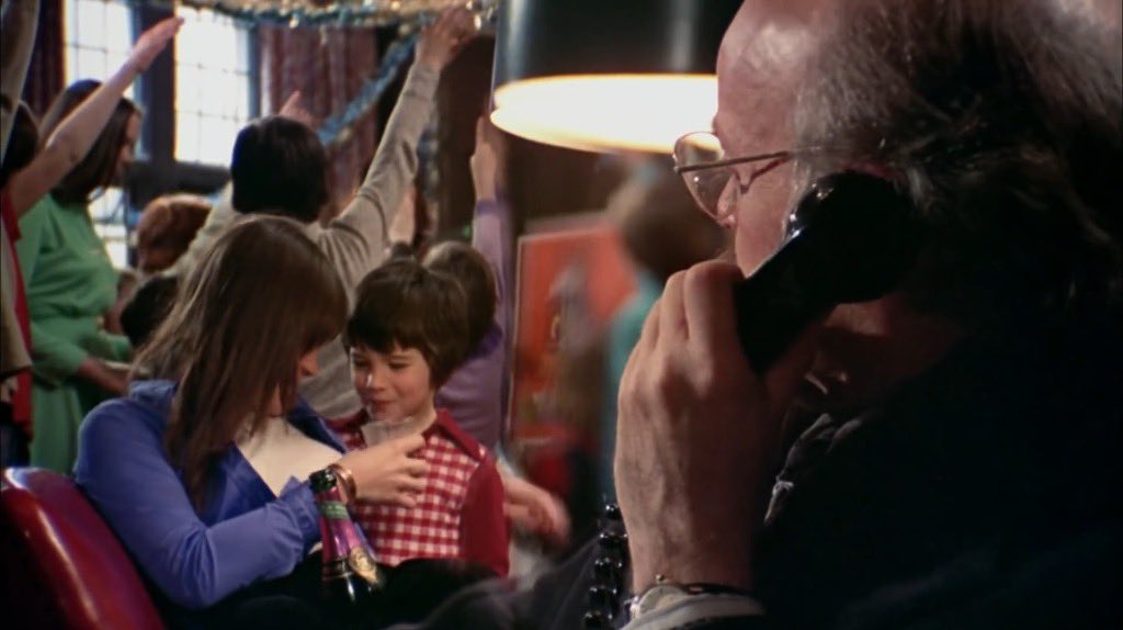 JakeTropila's tweet image. Margot Kidder offering a small child alcohol in a split diopter shot in Black Christmas (1974)