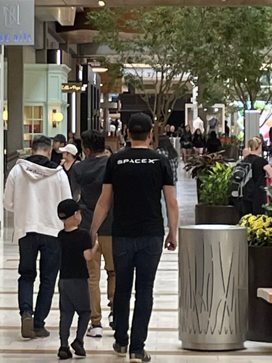 Spherical_Wave's tweet image. Life goals. My wife took a pic of me and my son walking together in the mall. I didn&apos;t realize that he is trying to dress like me. I love it