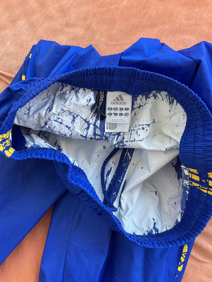 Hello guys or pups I have question. Please
How should I remove the rubber layer (white) inside the pants and the yellow Adidas strips ? 
Without destroying the waterproof pants themselves. Thank you. 🧡💙