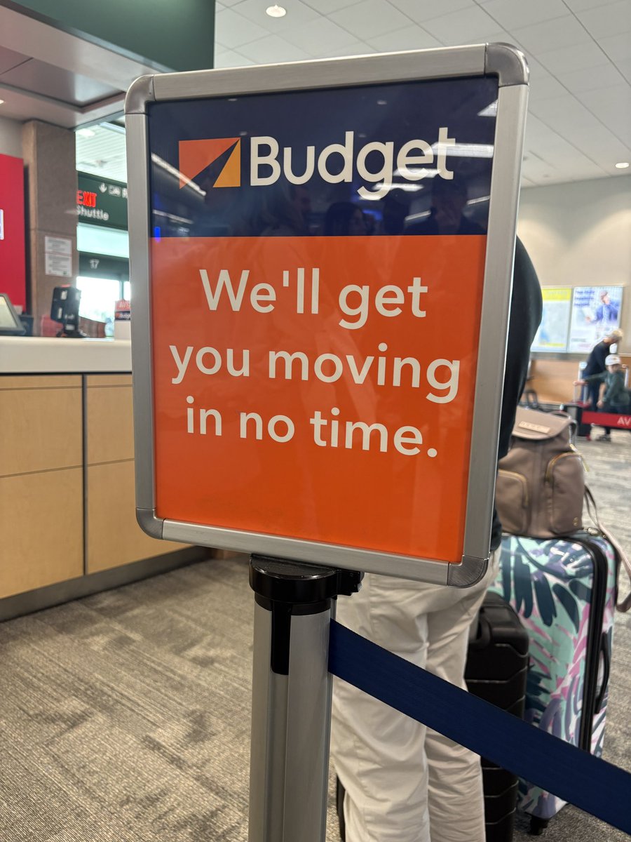 TZOH's tweet photo. Do better @Budget. 
2 hour line, 1 attendant at SRQ. Truly ironic signage at the counter. 0/10. Do not recommend. https://t.co/Ku6E3DCqbY