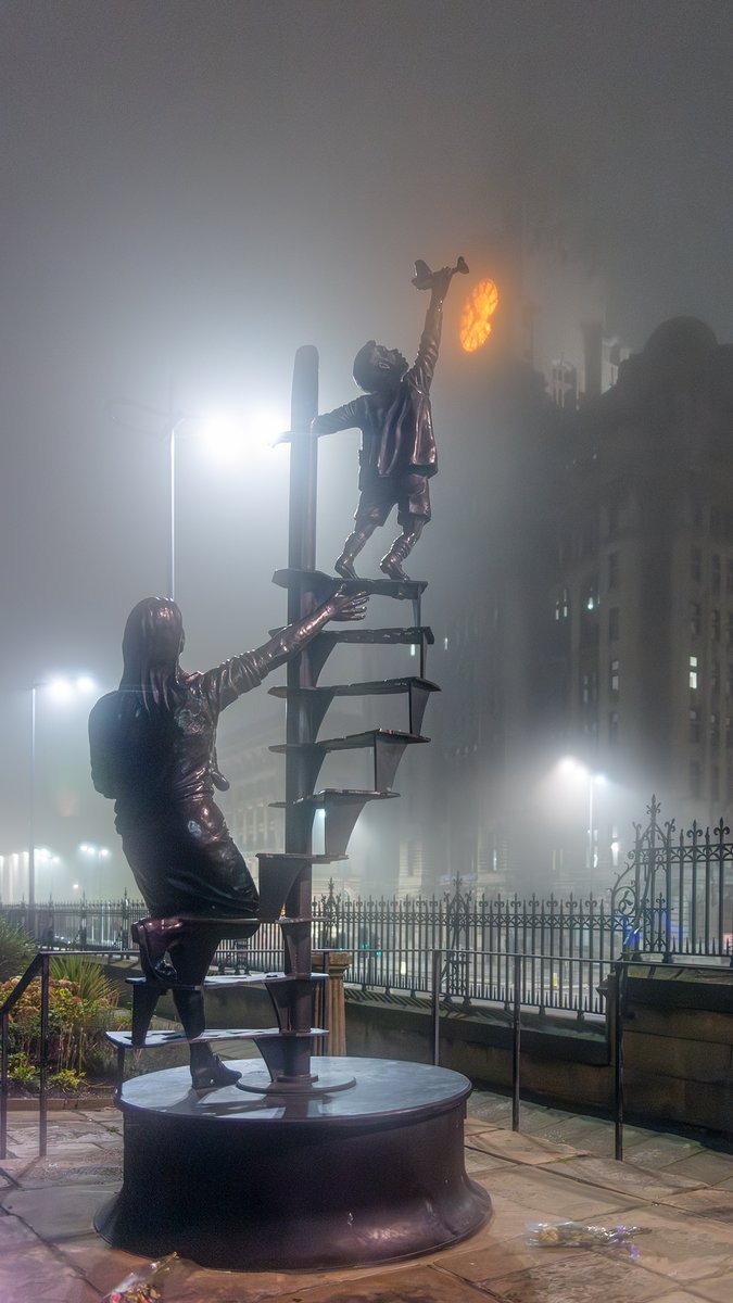 The bronze Liverpool Blitz Memorial in the grounds of Our Lady and St Nicholas Church Garden. Sculpted by Tom Murphy.