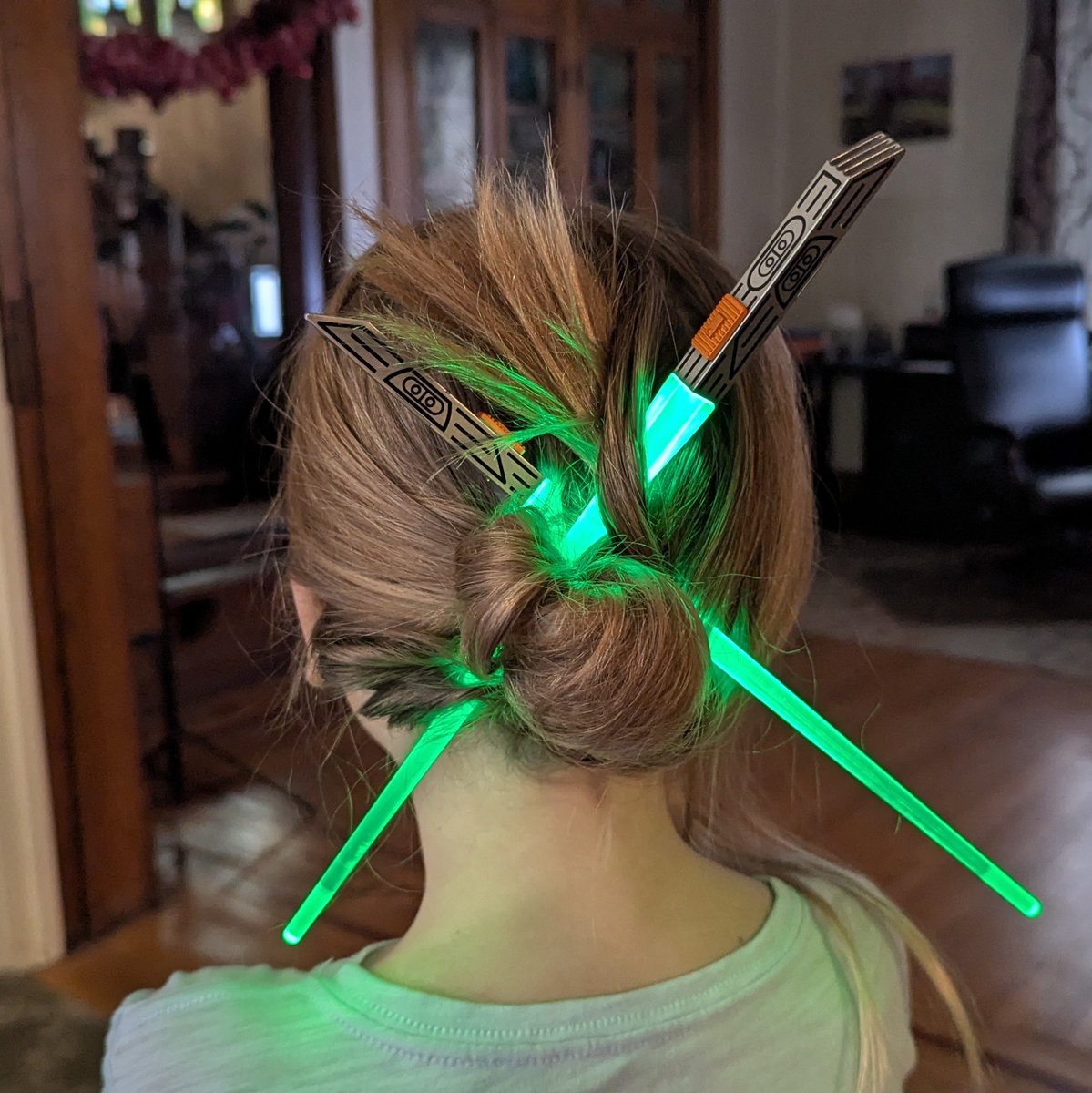 Lightsaber chopsticks work even better as lightsaber hair accessories. We're living in the year 3000 over here.