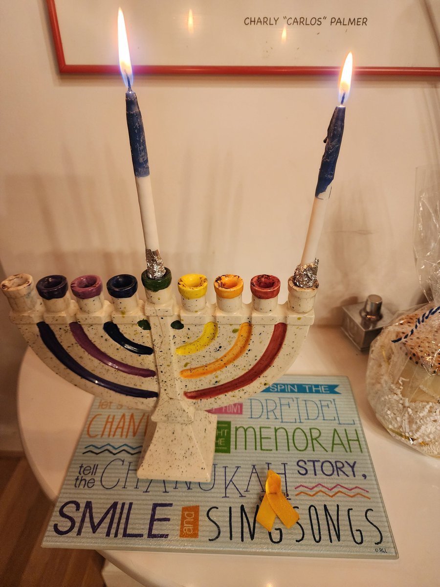akoren's tweet photo. The first two nights of Hanukkah. In addition to the lights from the candles, we're also including our connections to Israel and reminders that 100 hostages are still being held in Gaza by Hamas terrorists.   #BringThemHomeNow https://t.co/O0eNyoGA8D