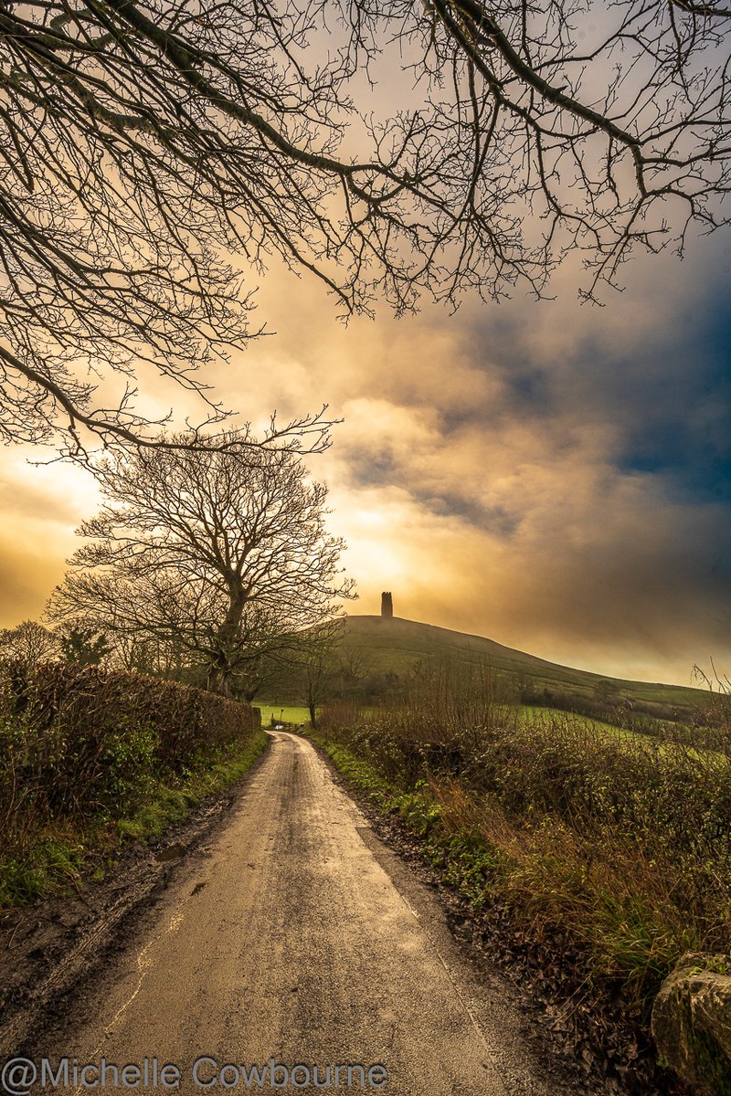 As the fog lifted a bit, the light started to peep through the clouds as if to say, I am still here! #glastonburytor