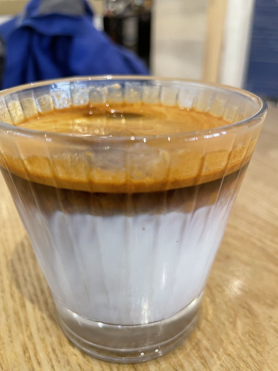A dirty coffee. Cold milk with a shot of hot coffee on top. One of the many ways that dairy intake is increasing in China. 

Also if I go to a coffee shop (not often) and they have this with normal milk (not that plant based shit) then I usually have my coffee this way.