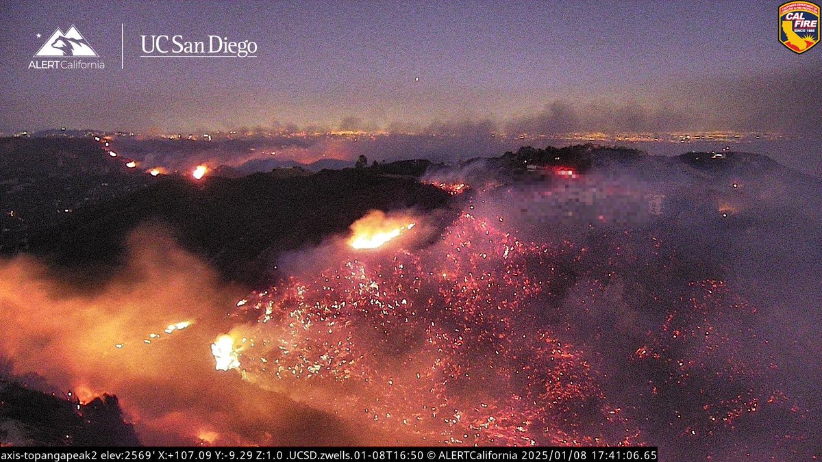 No words for what we're seeing on this live-camera. Multiple areas of fire activity with hundreds of structures being threatened in the path.