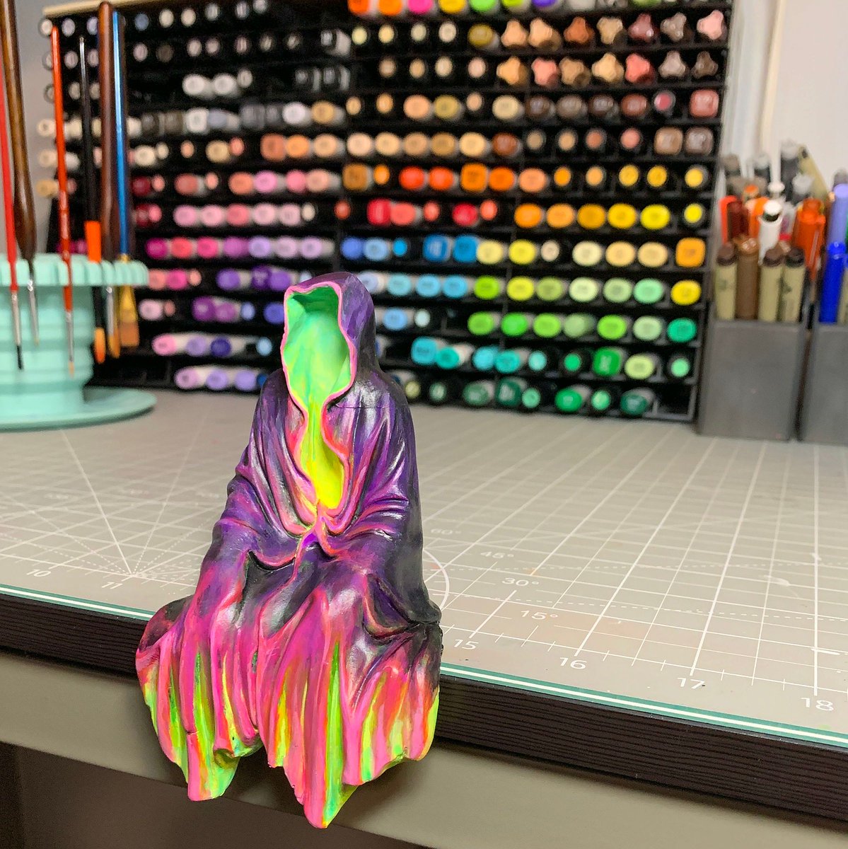 Yamcans's tweet photo. Meet the "Neon Ghoul" - Once, a black, plain Temu figure, now a fluorescent omen looming over my workstation. 👻✨ #CustomRepaint #NeonArt #FluorescentPaint #SeatedGhoul https://t.co/oaB51PtgBx
