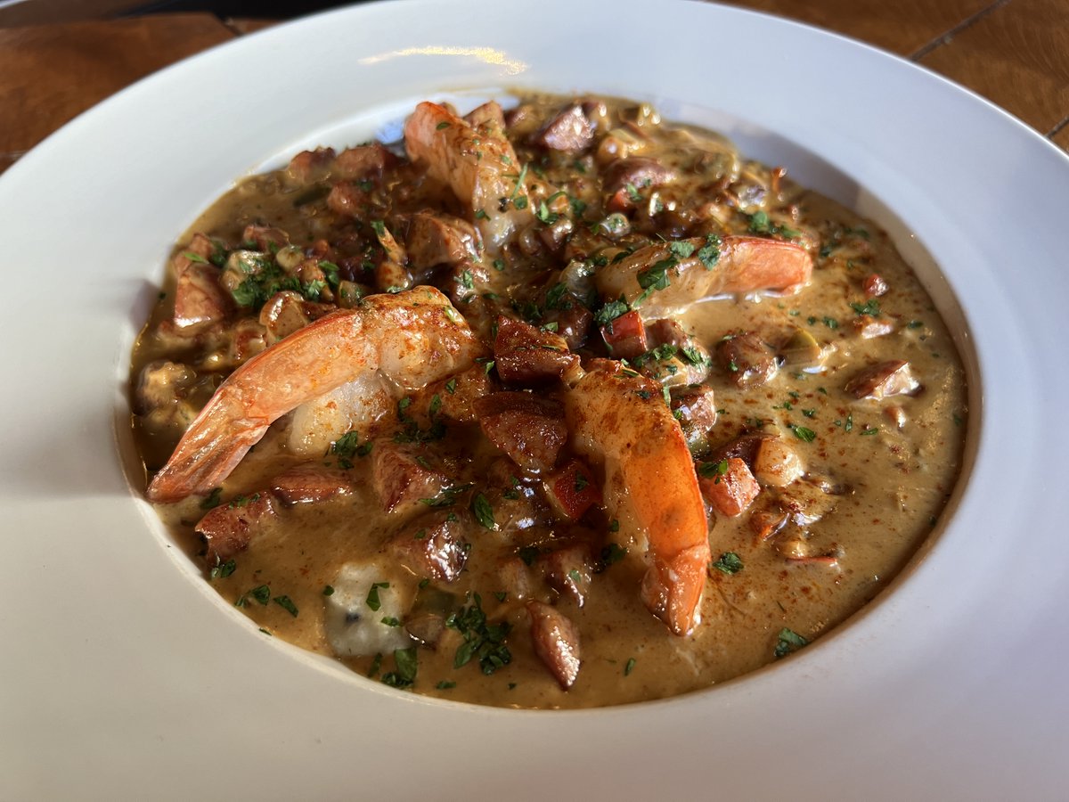 A Southern tradition with a Bourbons flair! Our Shrimp &amp; Grits features authentic Cajun sausage and jumbo shrimp, garlic, shallots, and red and green peppers in cream sauce, served over Weisenberger stone mill grits.