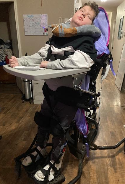 It's hard to believe, but my grandson Logyn turns 13 tomorrow!! A teenager. This last year has been quite a struggle for all of us, but we have faith and won't give up. Here he is in his "stander"
Last year I asked for a 12-for-12 campaign for his GoFundMe. The outpouring of love