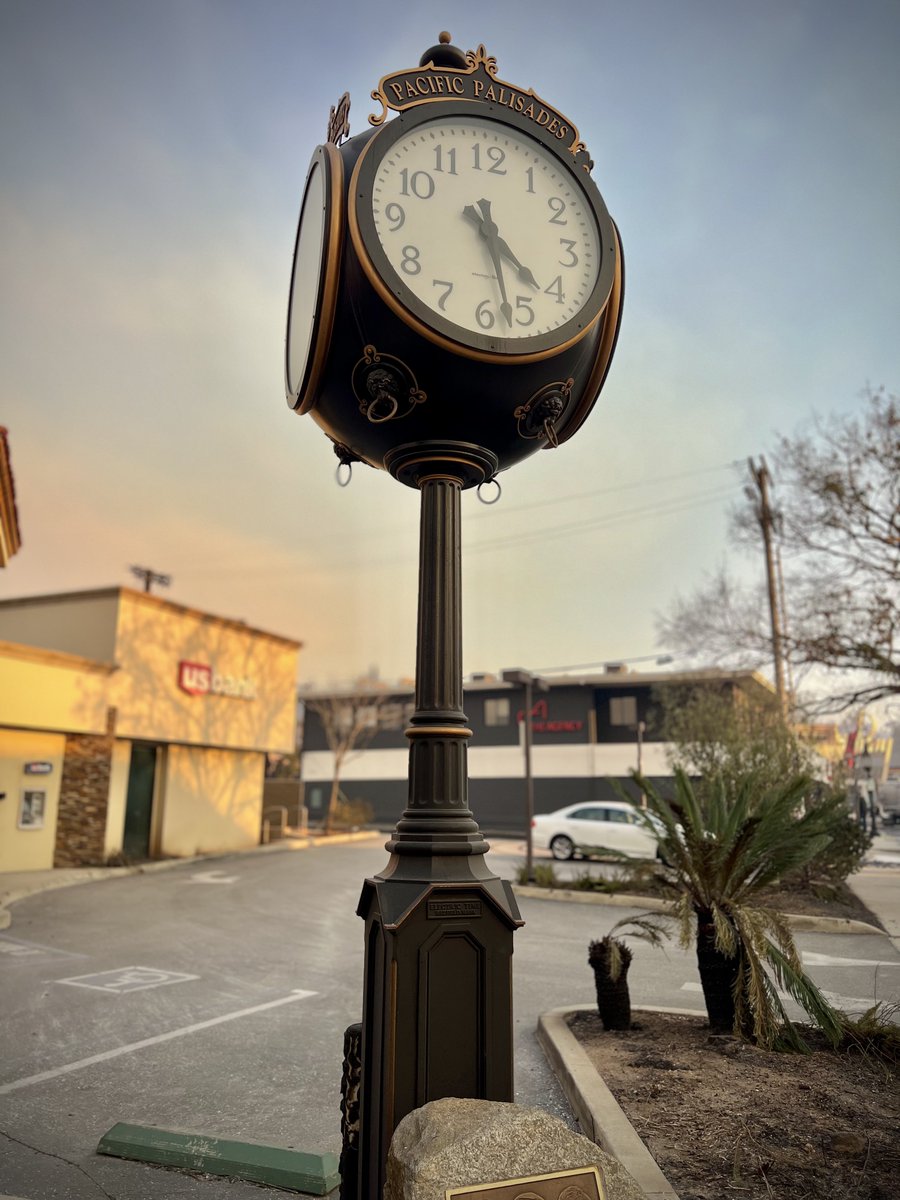 This frozen clock in Pacific Palisades shows the time that power went out during the firestorm. Located in front of the US Bank building corner of Sunset Blvd and Swartmore Ave. Businesses that had been in this community for decades were destroyed here. #PalisadesWildfire