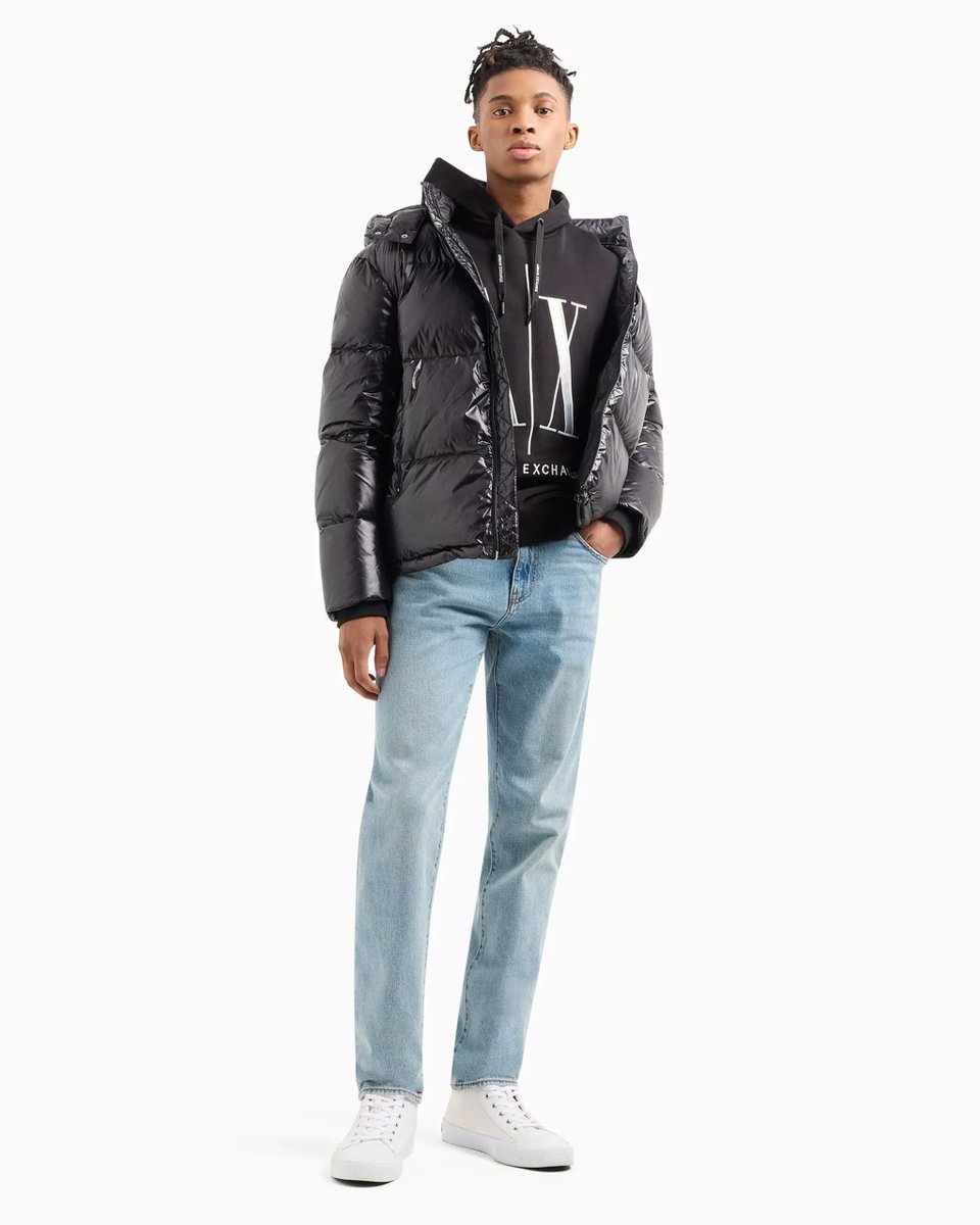The Armani Exchange Men’s Black Hooded Jacket. This sleek jacket is designed for the Fall/Winter season and offers unbeatable warmth, comfort, and a modern, minimalist look. Whether braving the elements or adding a stylish layer to your outfit, this jacket has you covered. Its