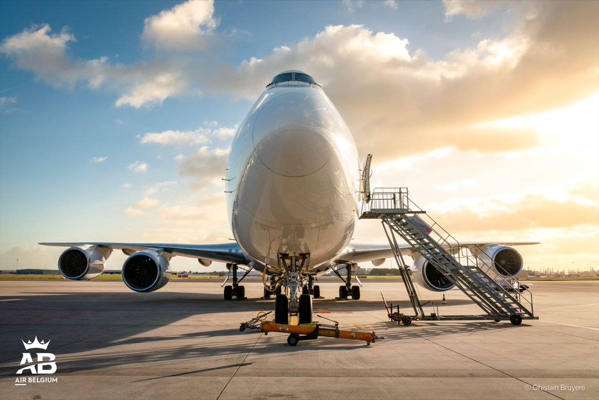 Airbelgium's tweet photo. Bright skies for the 'Queen' 🌤️ Our B747 is ready to carefully deliver cargo around the globe ✈️

#AirBelgium #FlyBelgianClass #B747 #Cargo https://t.co/xxTVwobjQm