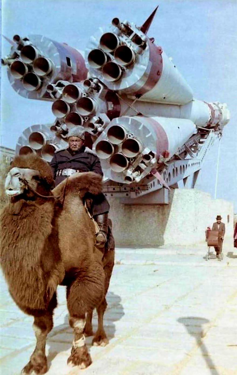 Nope, it's not a "Star Wars" set—though it easily could be! 

But let's get real... it's a chilled guy posing on a camel in front of a Soyuz rocket. 
Baikonur Cosmodrome (Kazakhstan) in the '80s
Unknown photographer but 100% interstellar style! 
#astrographycom #starwars