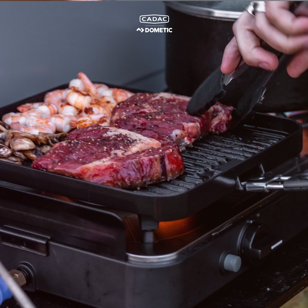 "Living the dream 🍃🌅 Cooking up some epic surf and turf 🦞🥩 right out the back of the Land Rover Discovery beside the cliffs, with an ocean view to die for 🌊🏞️.

📸: @overlanddiscovery2"

#OverlandLife #AdventureAwaits #CadacDometic #LandRoverDiscovery