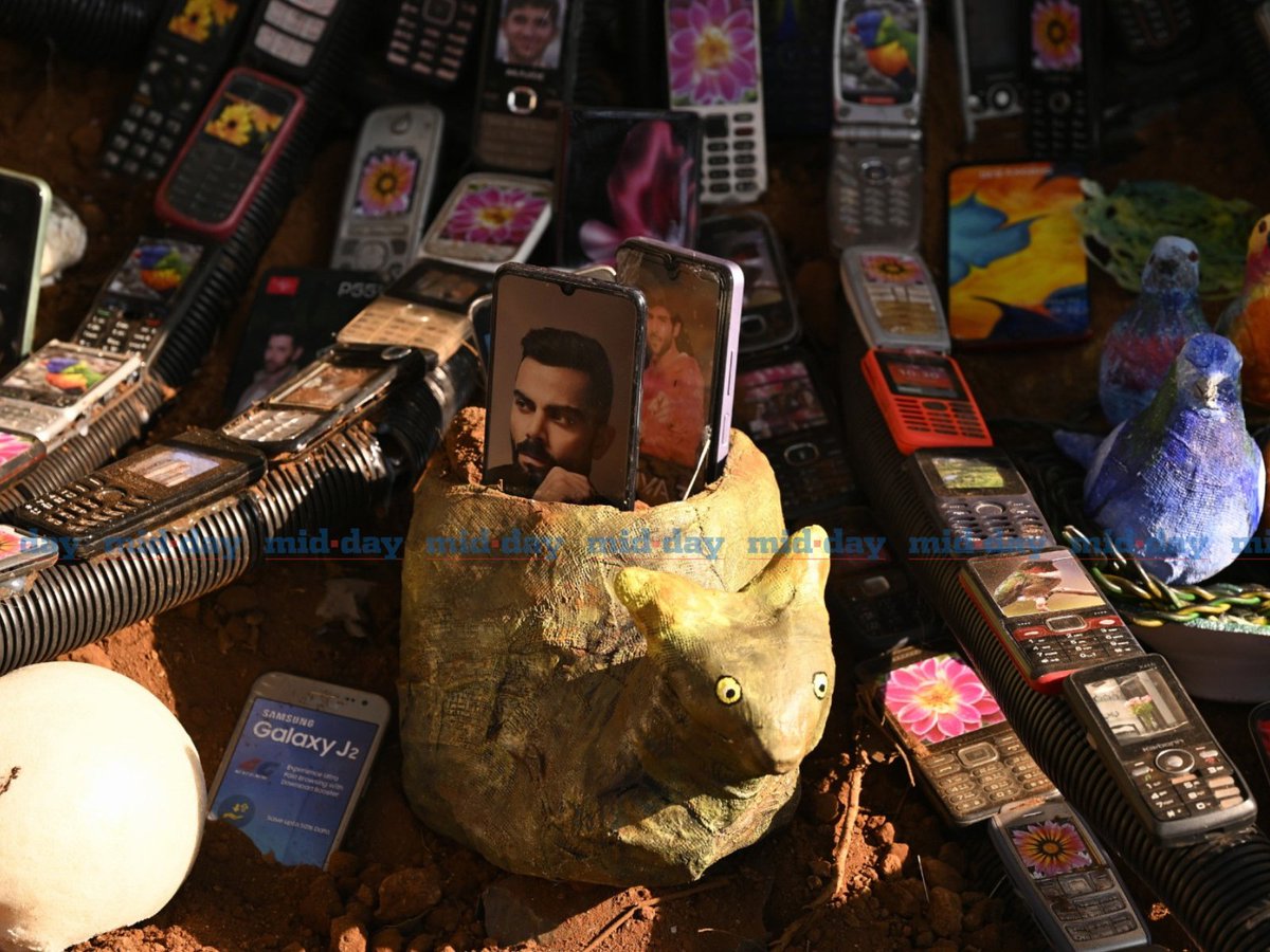Vishwanath Mallabadi, founder of The Upcycle Store, creates a unique art installation using 2,000 discarded mobile phones. Situated at The Nest in Malabar Hill, the piece promotes the idea of disconnecting from technology to reconnect with nature in this urban forest haven.
