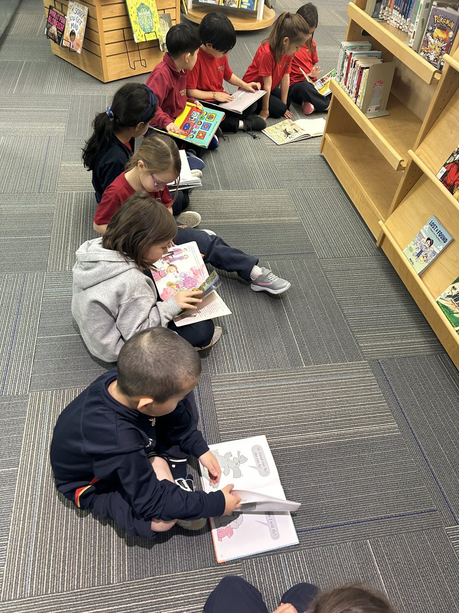 Picking new books and so excited about being back in the Library