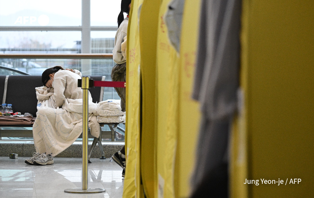 Flags fly at half-mast for South Korea's worst plane crash.

Seven days of national mourning have started, with the acting president flying to the crash site for a memorial as teams of US and South Korean investigators race to establish what caused the disaster