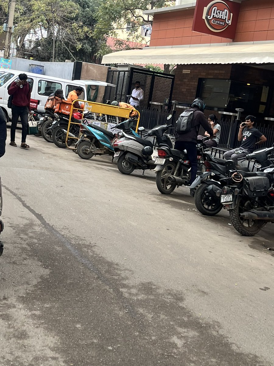 bro2code's tweet image. I don’t understand how Asha Tiffins restaurant got a license to use the road as parking space. Traffic is worsening with Zomato and Swiggy riders waiting on the road as the restaurant doesn’t provide parking for anyone collecting orders, along with Asha Tiffins customers parking…