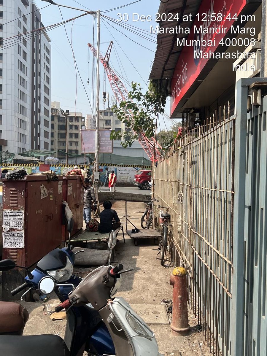 Footpath usurped by druggies &amp; family outside Kotak Mahindra Bank, Maratha Mandir ( Oscar Tower ) 

Serious threat to bank security and well being of residents. 

Pls take immediate action.