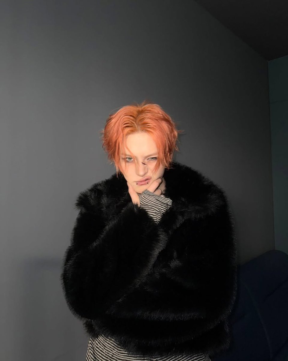 Caught somewhere between shadows and fire. The copper flames in my hair, the soft rebellion of fur draped over striped monotony. I would like to thank Sabae noona for making me this cool.