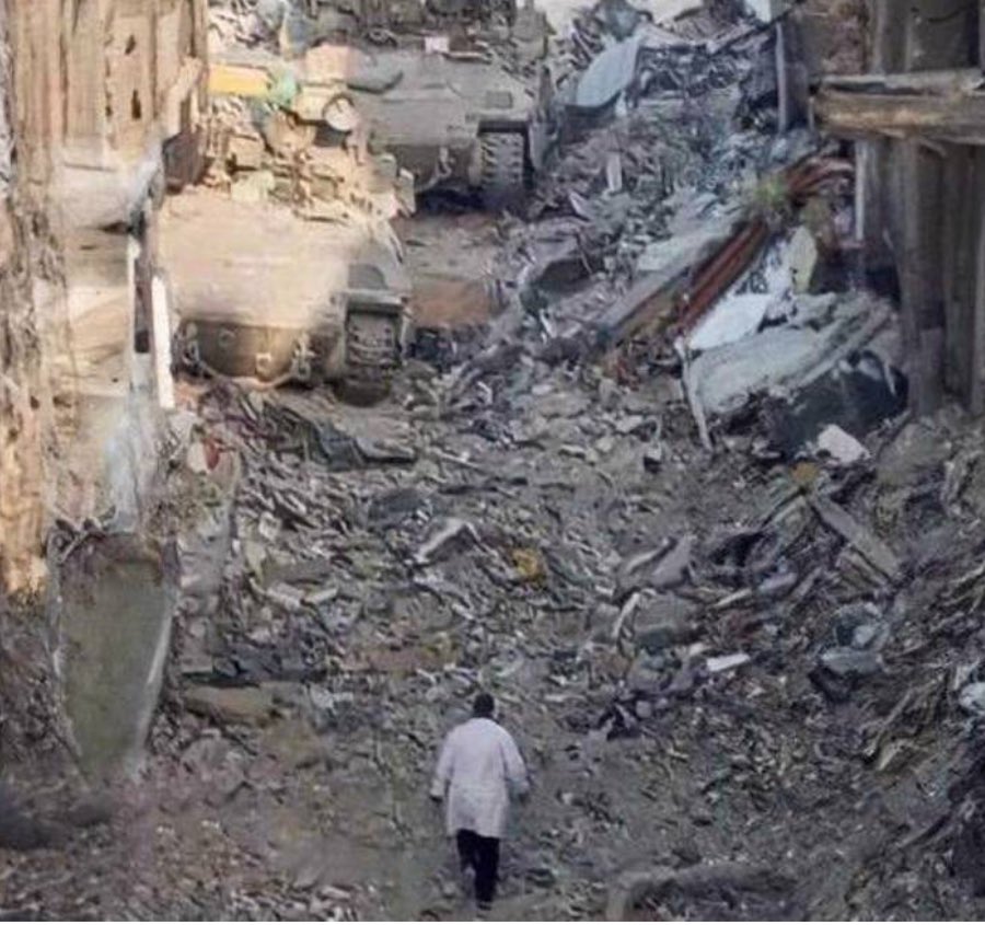 This is the last photo taken of Dr Hussam Abu Safiya. I can’t stop looking at it. 
A doctor with no weapons just his white coat walking towards merciless tanks. 
His weapon is his integrity, his backbone and his values. 
This photo alone is so symbolic, with nothing but that