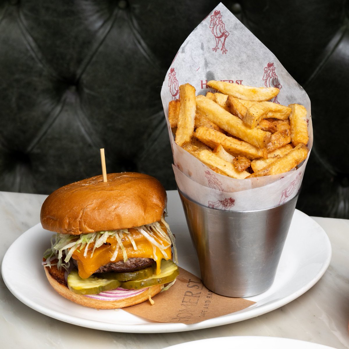 Juicy, flavourful, and always satisfying—our HSCB Burger is a must-try. Made with a perfectly seasoned chuck grind, topped with cheese, bacon, &amp; our signature burger sauce, it’s stacked with shredded lettuce, pickles, and onions for the ultimate bite, it’s a classic done right!