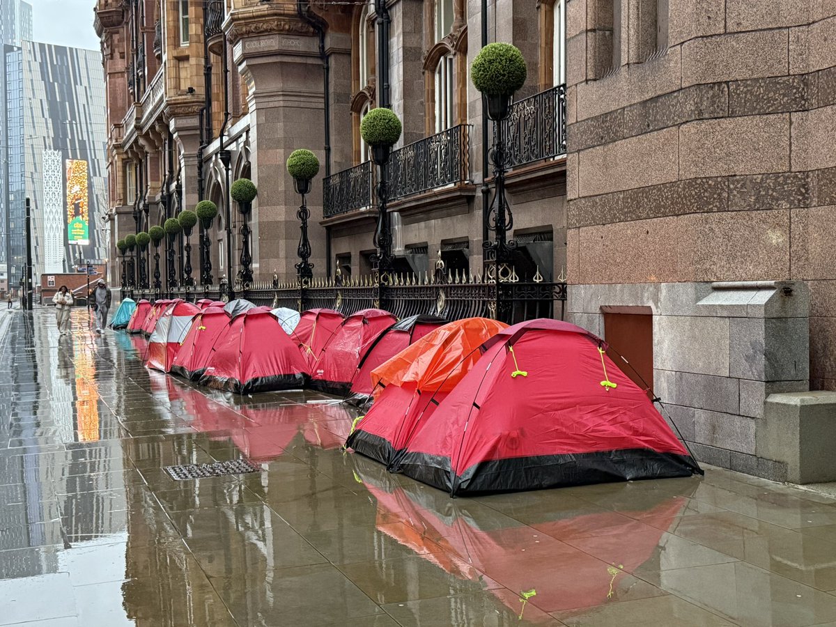 Homeless camp replaced by porta loos and burger vans for New Years fireworks display which probably should be cancelled. The tents relocated to the pavement between the Midland Hotel and the tram lines. This IS Manchester something something …