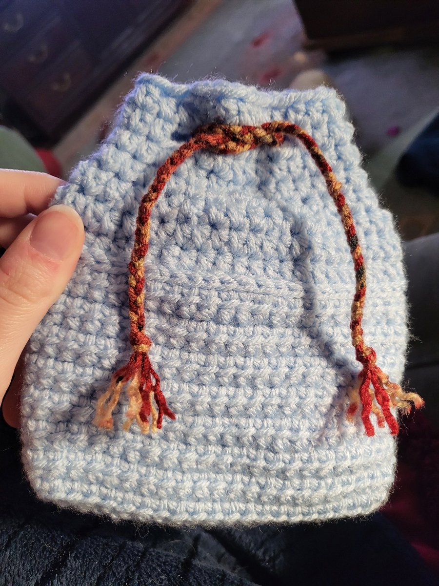 Final project of 2025! A little blue bag with a little red-and-gold ribbon.