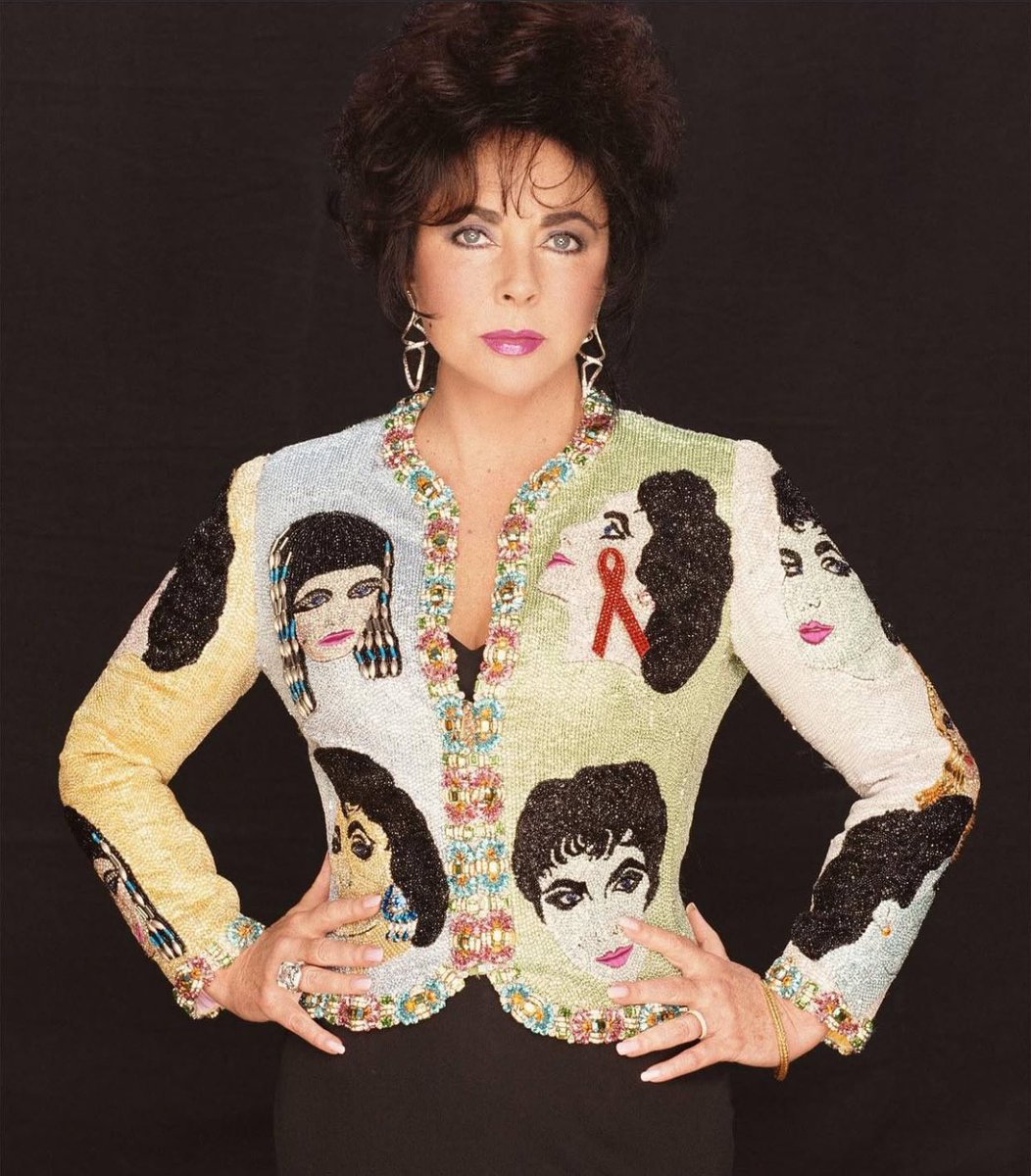 Liz Taylor wearing a Versace jacket with portraits of herself, 1992