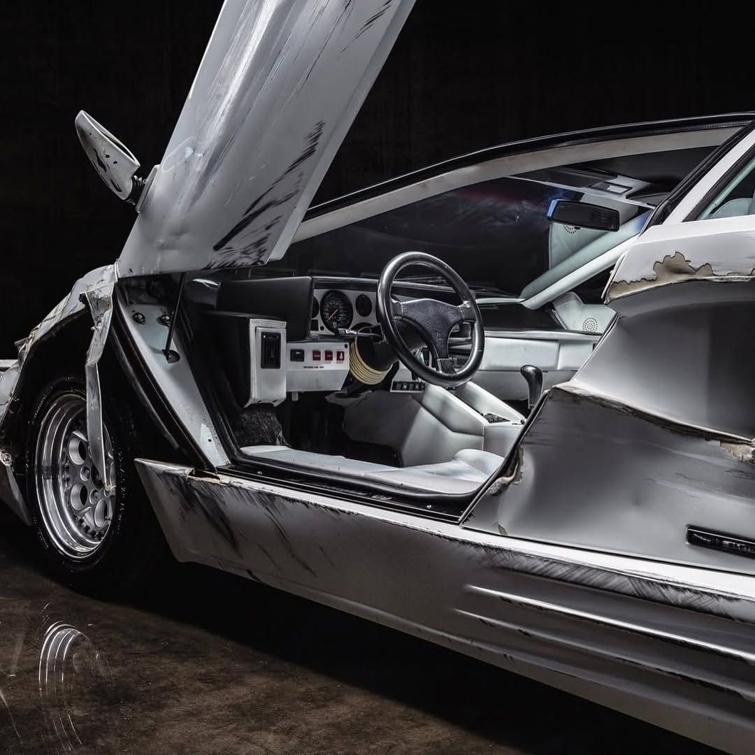 motorforms's tweet photo. The iconic white 1989 Lamborghini Countach used in The Wolf of Wall street 

To preserve the car's condition, the production used a replica for scenes involving damage. The real Lamborghini was used for static shots and scenes where it remained undamaged, while a stunt car or modified replica was employed for sequences depicting the vehicle's destruction