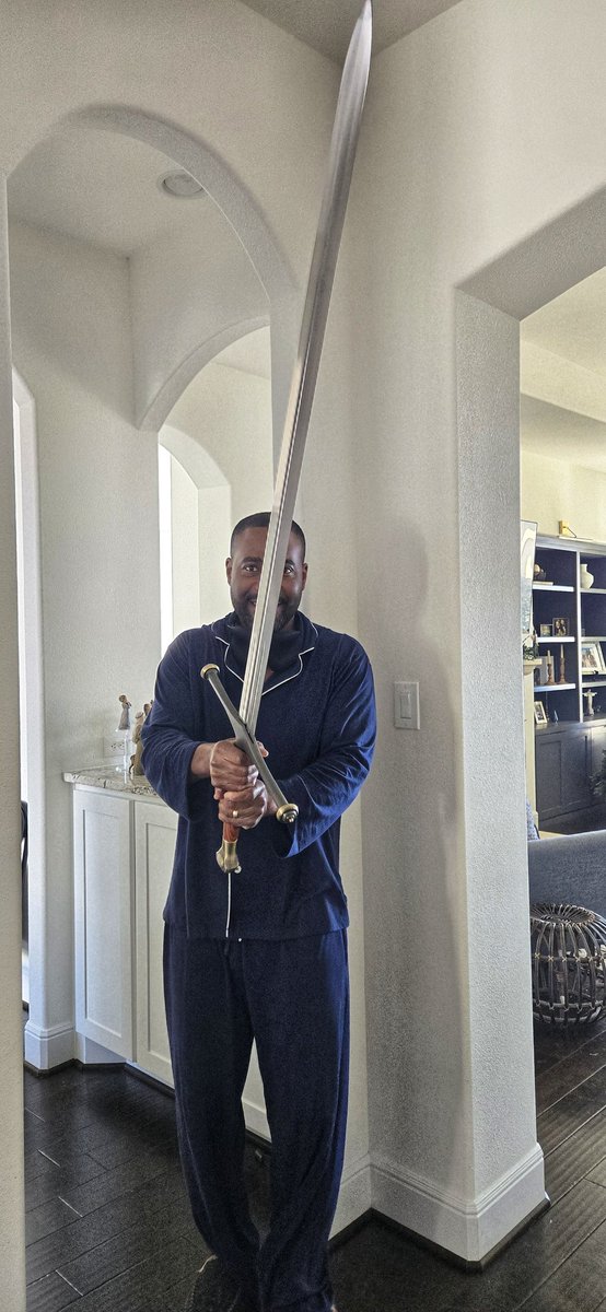 thekeithgarvin's tweet photo. Ephesians 6:17 --

"And take...the sword of the Spirit, which is the word of God."

My favorite Christmas gift this year ☺️ And yes...I walk around the house in pajamas with my swords all the time 😆 https://t.co/UsD9UiUsFr