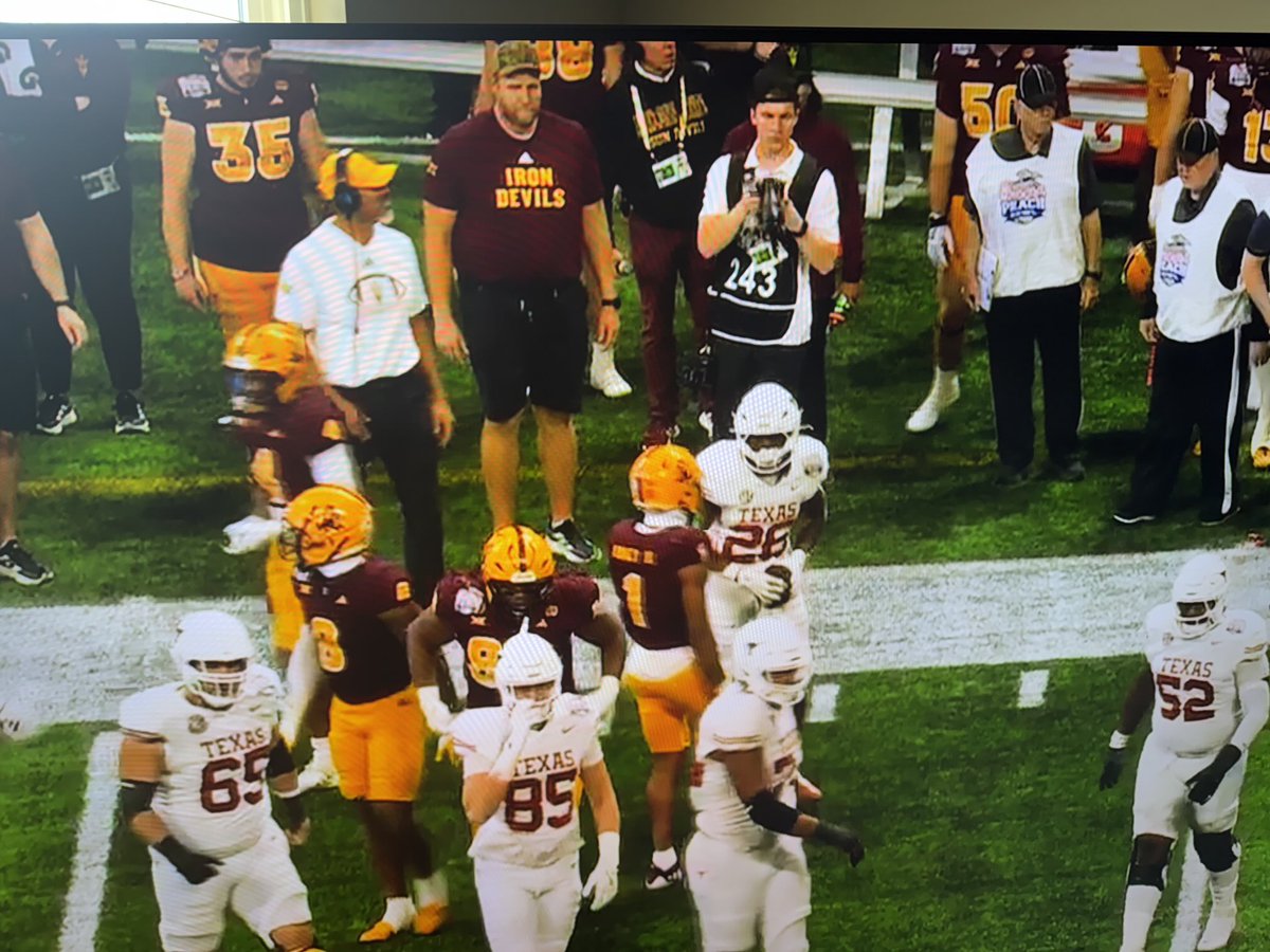 gooding_t's tweet photo. Even tho ASU is trailing in the Peach Bowl, my good friend’s son, ⁦@Coach_Diron⁩ Reynolds (top left w/headphones) assistant defensive line coach, has his guys keeping things close https://t.co/QPQ8CJEkC4
