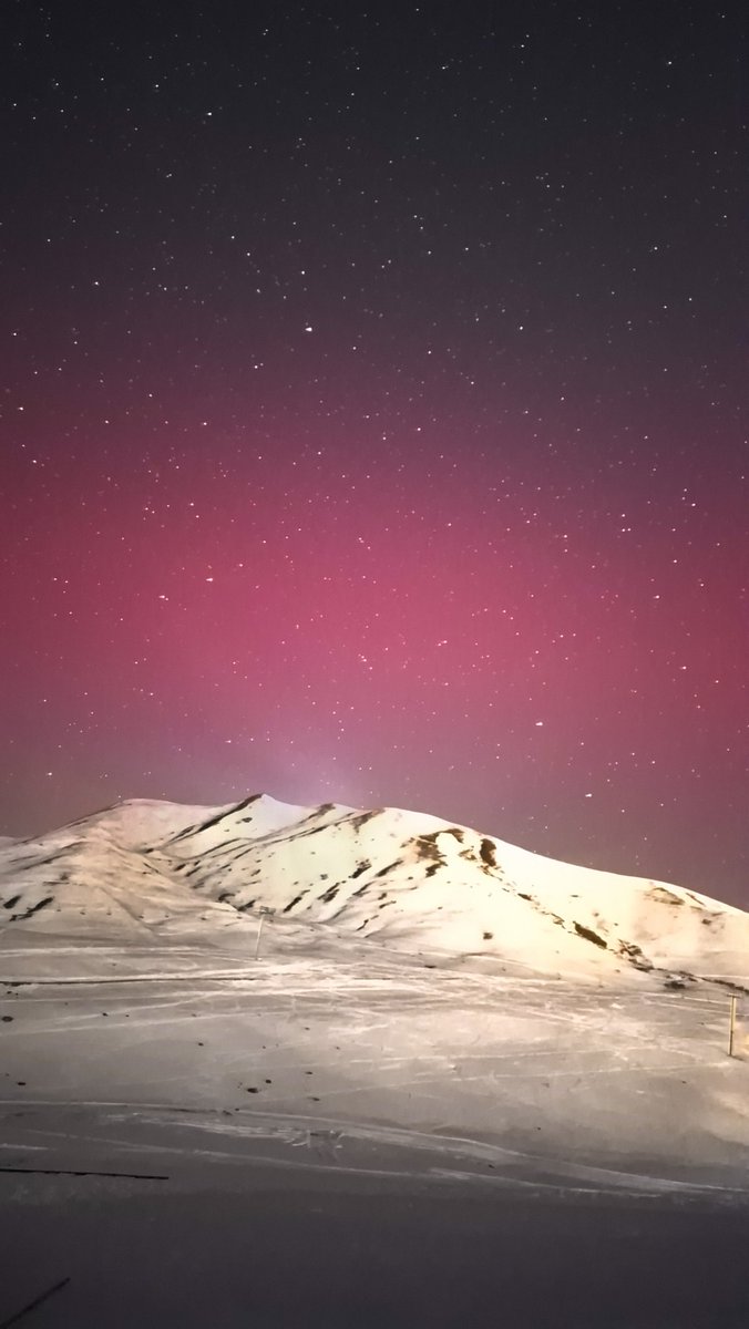 NaNoN9's tweet photo. NYE Fireworks ! 2025 begins with a blast here in the Alps, with the impressive pinks and reds of one of the strongest Aurora storms of the current solar cycle https://t.co/5JsiY7in5R