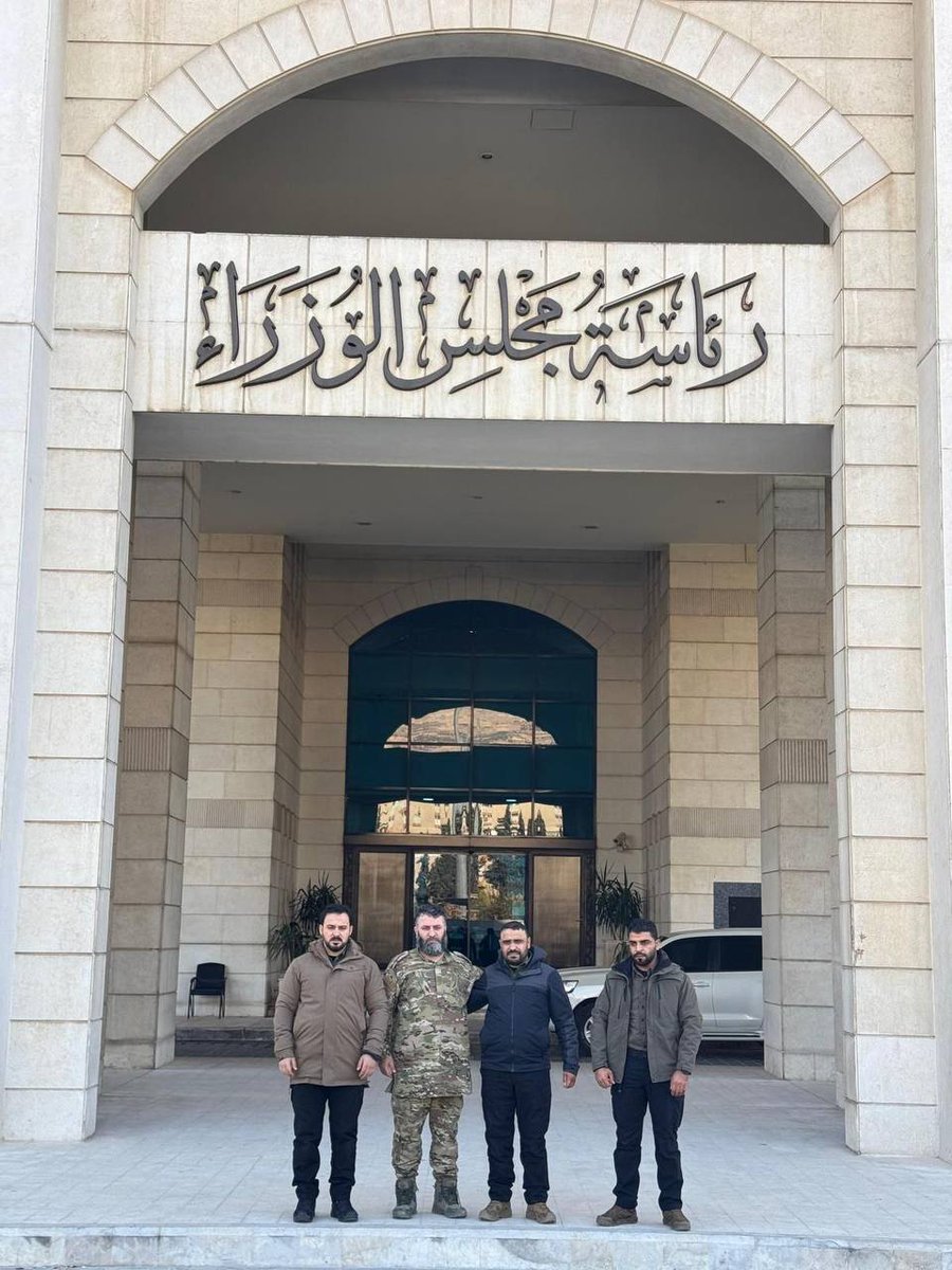 Mohamadnur1978's tweet photo. "Turkish jihadist Omar Mohammed Chevci, on Turkey’s terrorism list, is promoted to colonel in Syria. Turkish media question this farce, tied to Erdoğan’s government. He’s pictured with Abu Amsha at the PM’s office. Note: Speaks only Turkish. #Turkey_ISIS #Erdogan #terrorism https://t.co/vS4zbArjEO