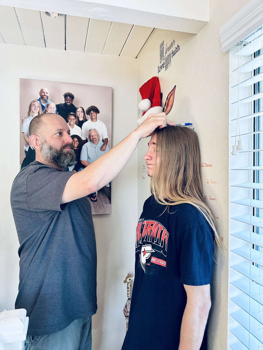 Measuring my oldest on his grandparent’s wall.