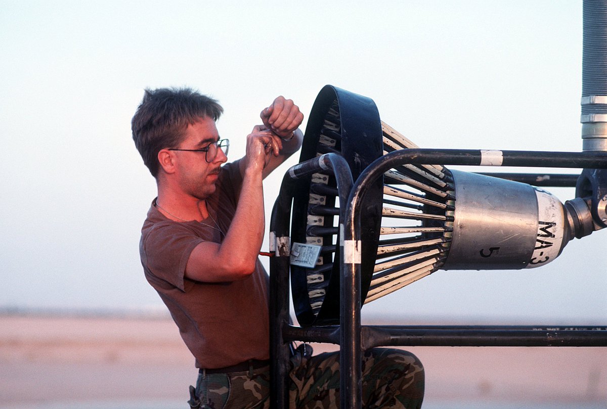 Finally... I've found an image that demostrates how big the basket of the KC-135 Boom Drogue Adapter really is.

National Archives DF-ST-92-00604
