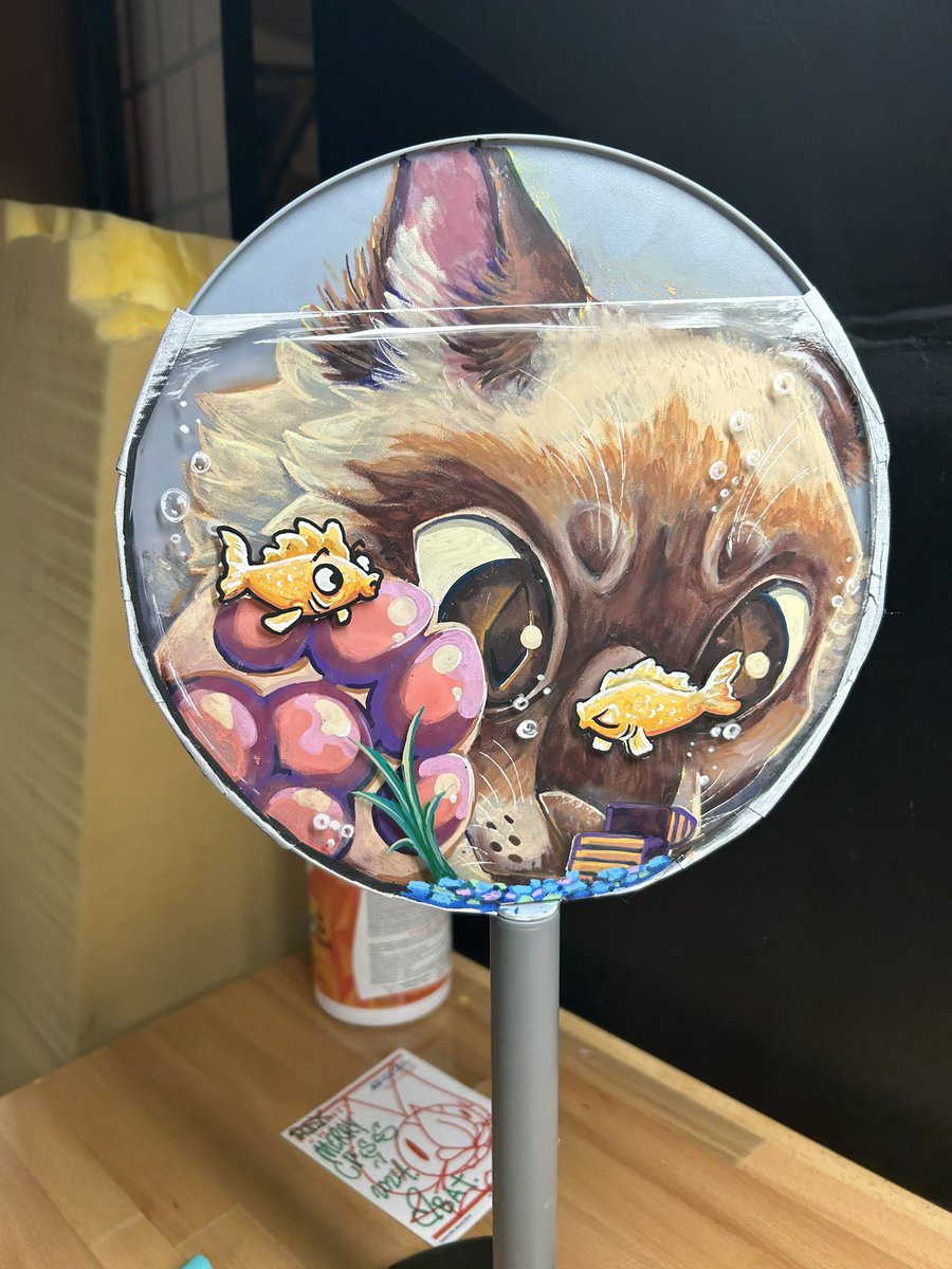 GummyKaiju's tweet photo. Cat-fishing? 🤔 Maybe just a cat wanting to catch some fish! 
Its 3-D with a plexiglass piece in the front to simulate a fishbowl :] I had a lot of fun working on thi, it’s referenced by my own cat, Moth 🐈 
This is available at PDFC come stop by to check it out https://t.co/c26u4dsuXj