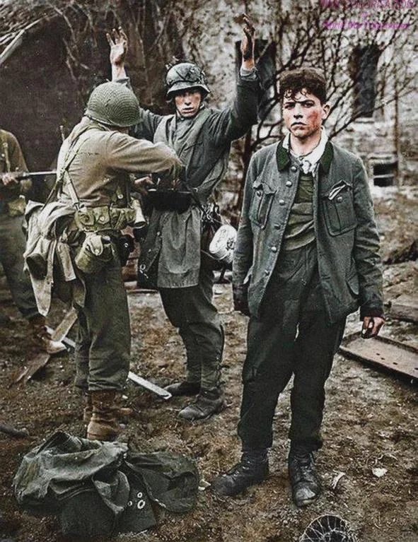 In 1945, 2 German snipers surrendered to a soldier with the 87th Infantry Division near Koblenz, Germany