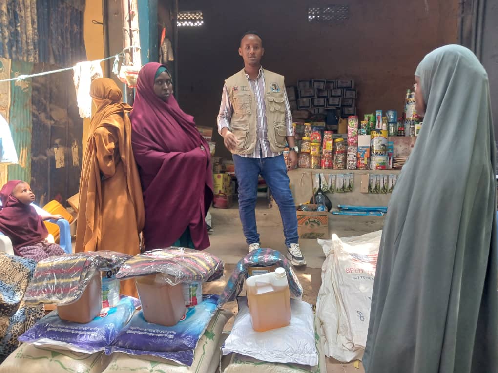 WamoRelief's tweet photo. Beneficiaries at the food shop redeeming the voucher card. https://t.co/7BEXy2cQ04