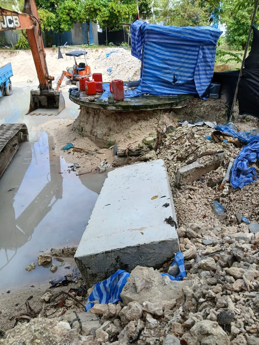 muththo's tweet photo. The Malé City Council and their contractor have acted in an irresponsible manner by carrying out excavation work at Maafannu Cemetery. They have dismantled the stormwater pump station there that serves the northwest side of Malé without notifying us. This has led to significant flooding in the surrounding area. We are currently seeking a solution to restore the pump station's functionality.